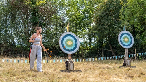 Teenager doing archery at Newtown Medieval Randy-O Fayre